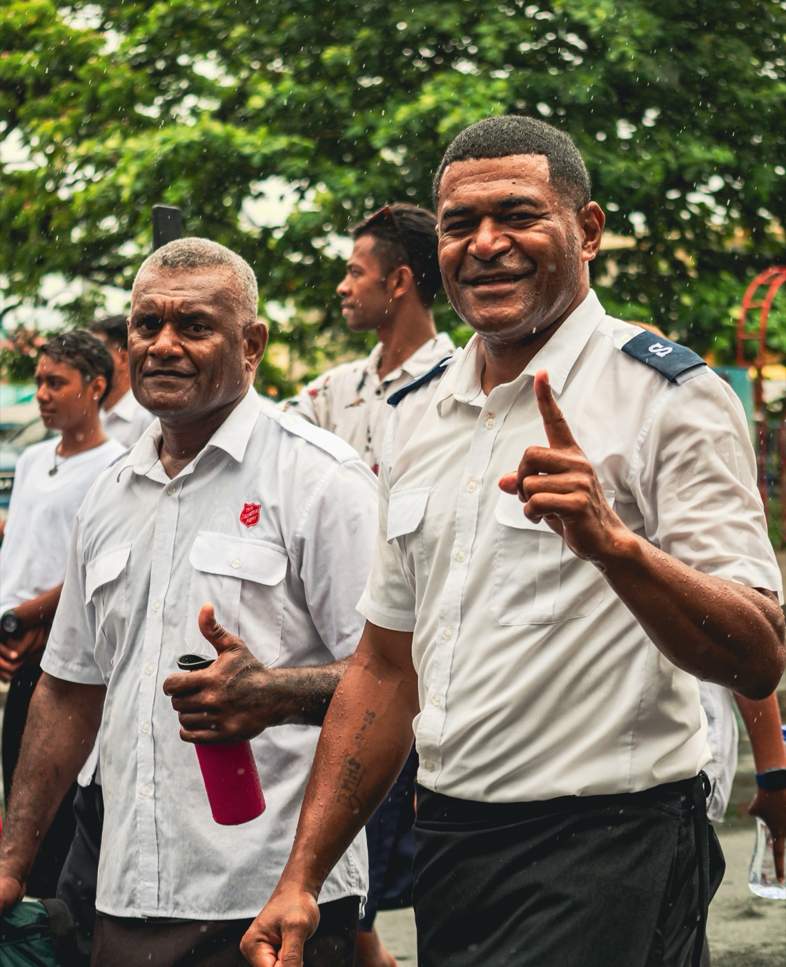 Salvation Army officer smiling mid-gesture